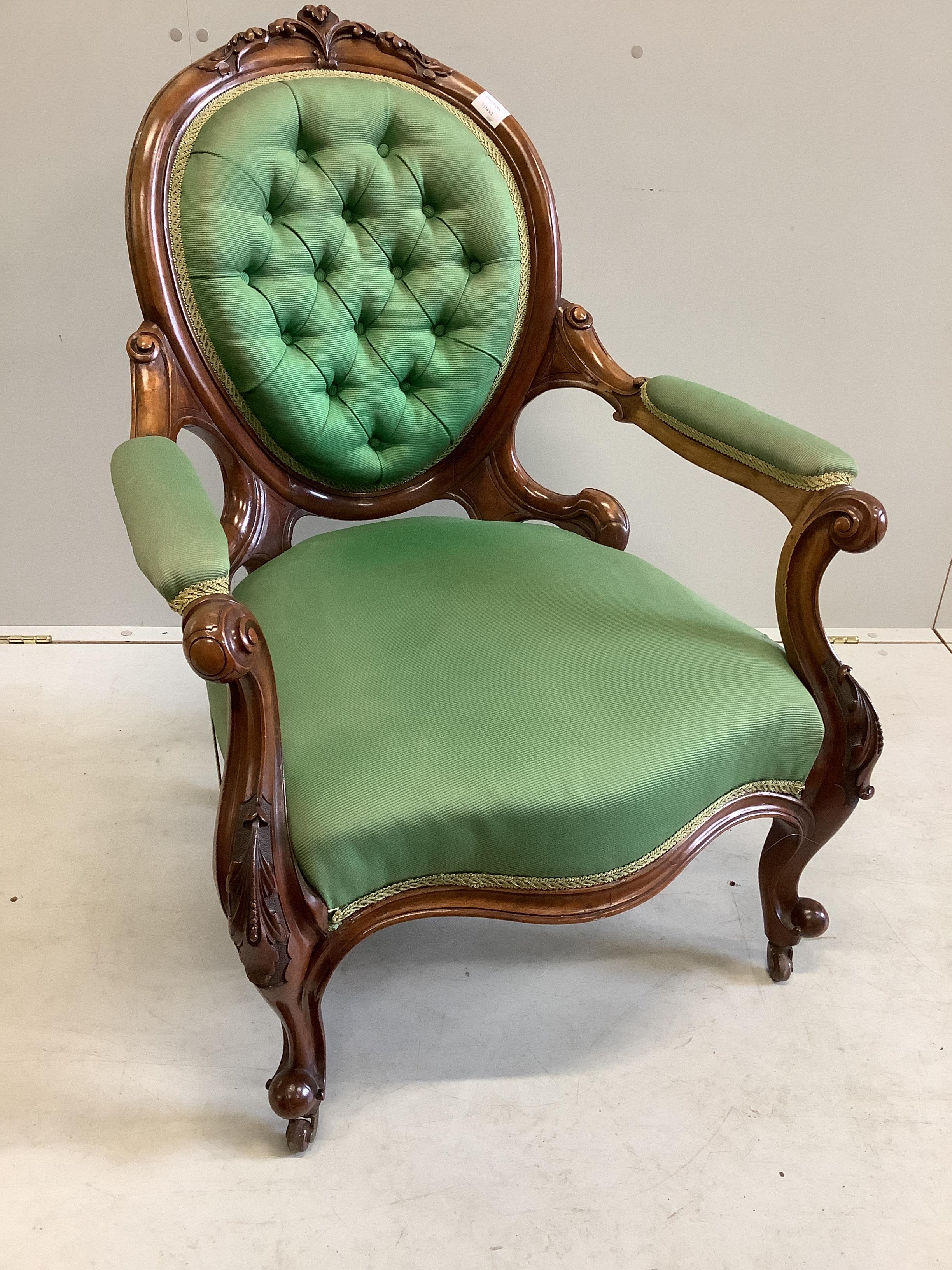 A late Victorian spoon back walnut open armchair, width 70cm, depth 60cm, height 94cm